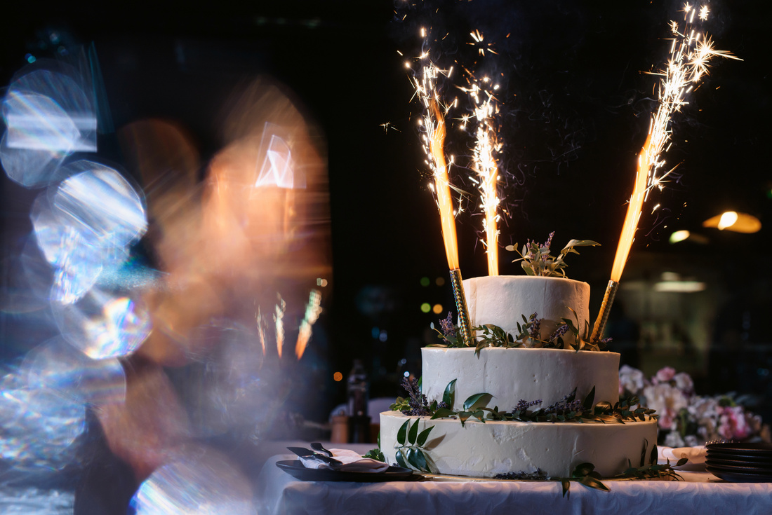 Classical wedding cake with fireworks at wedding party